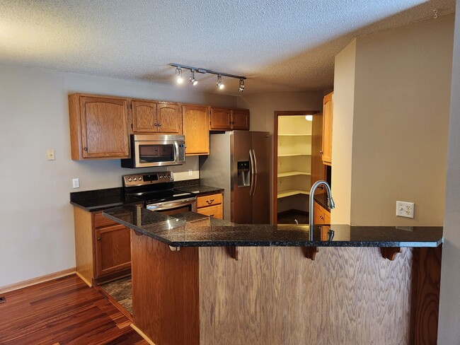 Photo - updated 2 bed townhouse under 2k per month in Burnsville! Open concept, master bed w/attached bat...