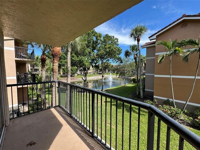 Building Photo - 9033 Wiles Rd Unit 208 Rental