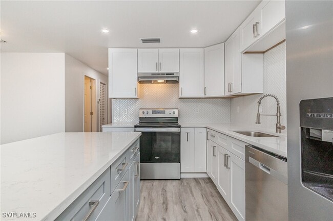Building Photo - 1300 Estero Blvd Unit 205
