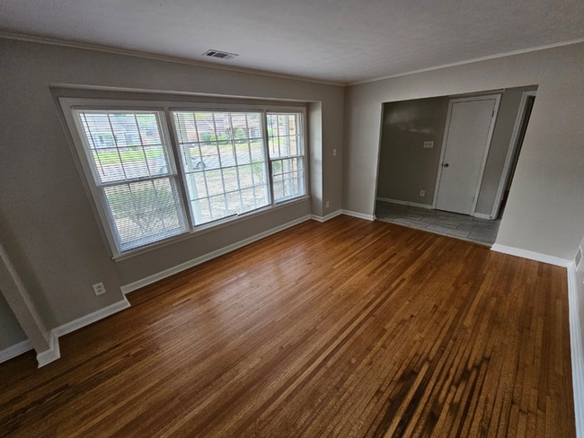 Photo - Massive 4BR/3BA Memphis Rental | Brick Fireplace & Built-Ins | Fenced Yard!
