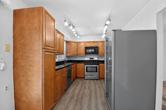 Photo - Welcome home to this light-filled, updated 4Bd/3.5Bth brick TH nestled in the sought-after Boniwo...