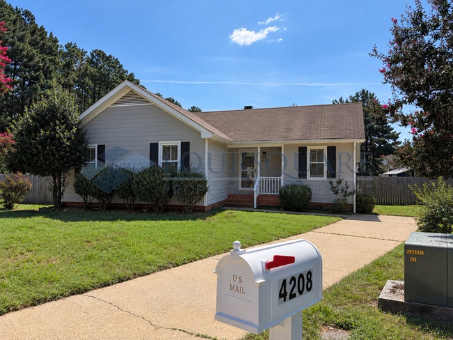 Charming Ranch Home with Large Deck, & Fenced Yard in Raleigh, NC