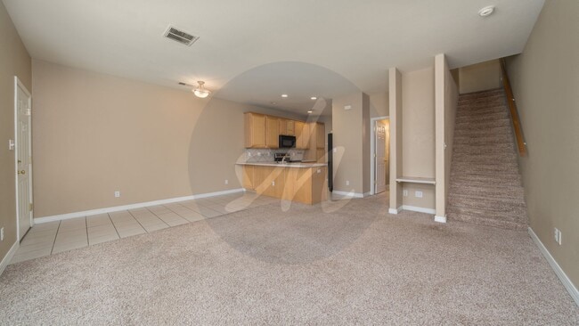 Photo - Spacious 3BR Townhome with 2-Car Garage & Private Covered Balcony