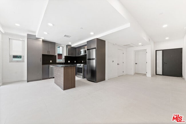 Building Photo - 1257 N Sweetzer Ave Unit 103