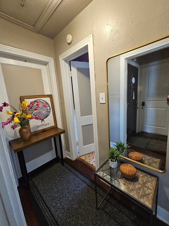 Hallway has coat hooks. - 2506 Elmen St Unit 2A