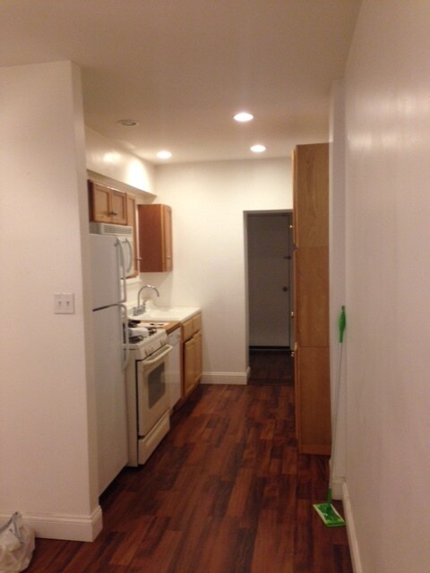 galley kitchen, half bath in rear and door to back patio - 1412 Orange Street