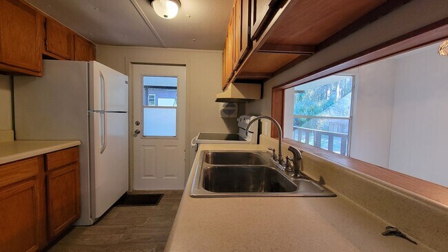 Photo - FULLY FENCED! 3 bedroom, 1 bath home plus a covered deck