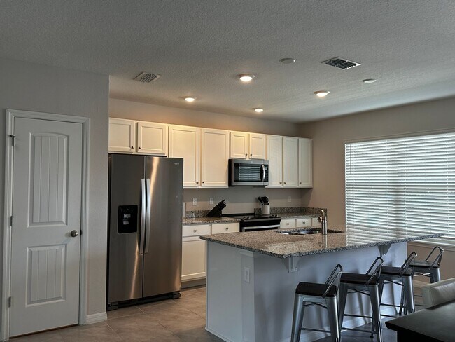 Photo - Resort Style Living! Stunning 3/2.5 Townhome in Waterleigh! Available April!