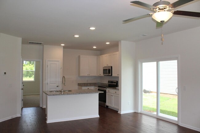 Photo - Sun-Filled 3-Story End-Unit Townhome with Fenced Yard, Storage & Resort-Style Pool