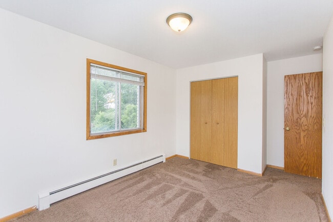 Cozy bedrooms with large closets - St. Croix Crossings Apartments