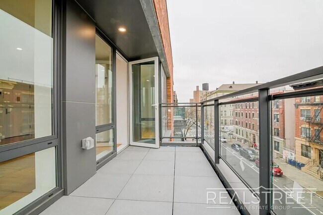 Photo - Light-Filled Corner 1BR with Private Outdoor Space & In-Unit Washer/Dryer Unit 4E