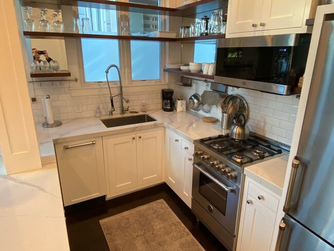 Photo - Exquisite top floor 1BD. Fully furnished a...