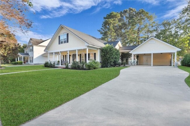 Photo - 4-Bedroom Home in Wild Heron with Front Porch and Fenced Yard