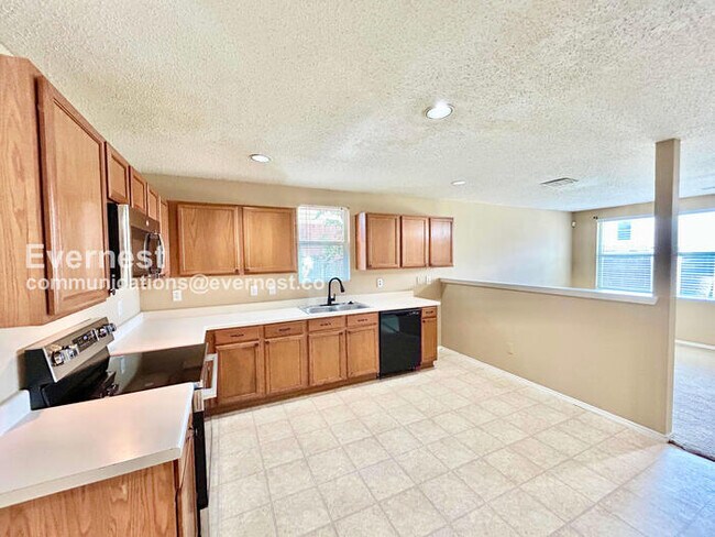 Photo - 4 Bed, 2 Bath Home with Fenced Yard & Garage / Available Now!