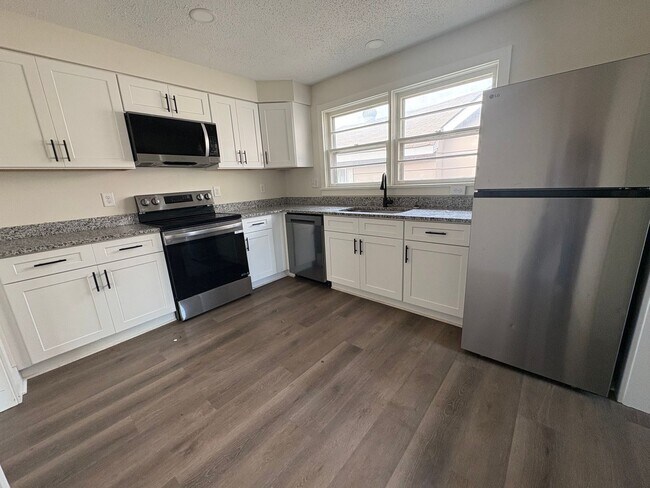 Photo - Fully Renovated 3BR/1.5BA – Prime Location + Lawn Care Included
