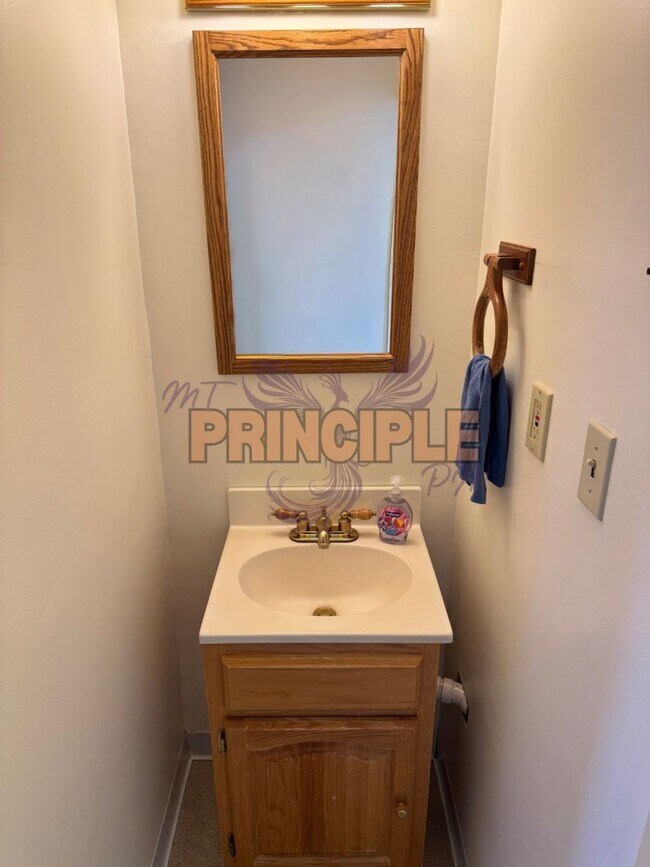 Photo - Charming Three-Bedroom Home with Garage and Yard