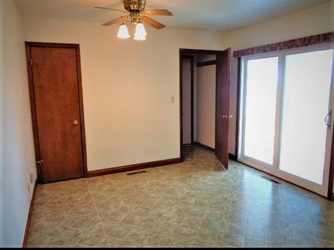 Kitchen dining area with pantry (left) and door to garage/basement