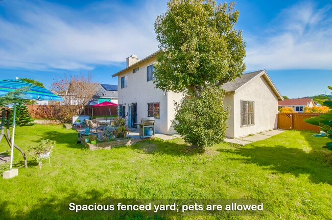 Your furry friends will love playing around on the grass in this fenced yard