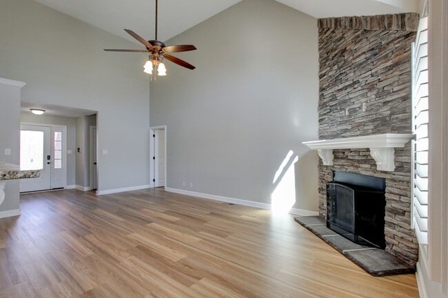 Photo - Fantastic Open Floor Plan Home With Stone Front Fireplace, Stainless Steel Appliances, And Close ...