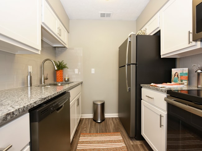 Kitchen with granite counters, stainless appliances & modern cabinetry