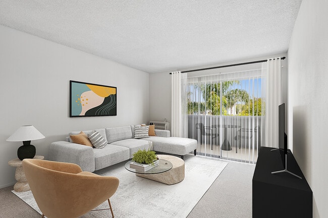 Renovated Package II living room with carpet (select homes) - AVA Pacific Beach