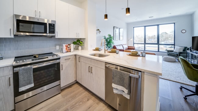 Kitchen with Stainless Steel Appliances and White Granite Countertops
