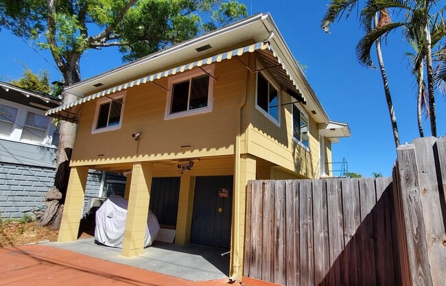 Alley view of garage w/fence - 1134 Bay St NE Unit 1134-1/2 Bay ST NE