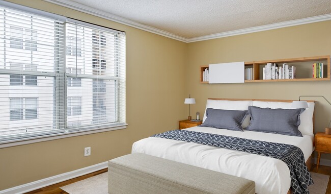 Spacious bedroom with wood flooring throughout