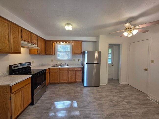 Photo - Charming 3-Bedroom Home with Spacious Backyard & Modern Amenities