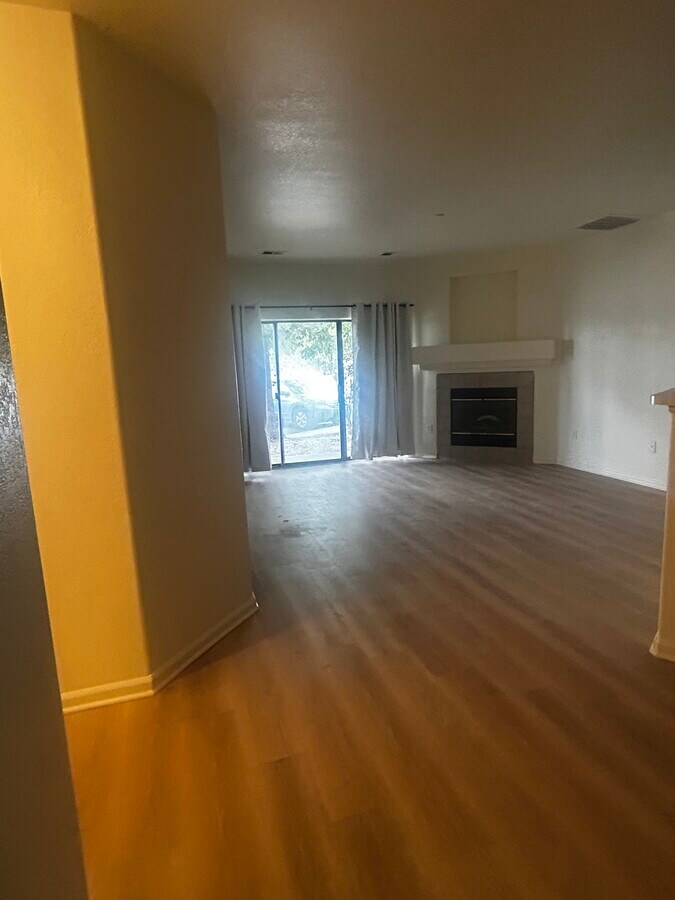 Living area with gas fireplace - 7454 S Alkire St Unit 103