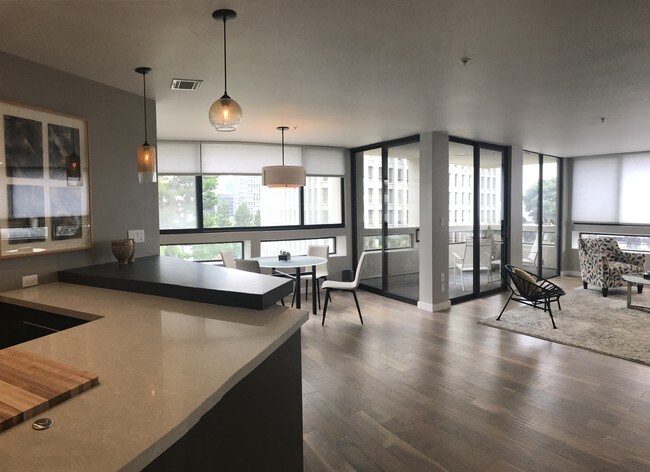 Open plan kitchen looking into living area - 121 S Hope St Unit 326