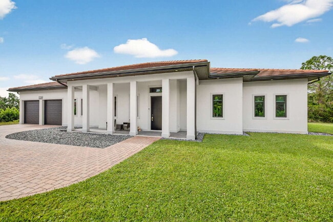 Newly built upscale home on a private 1-acre lot in the quiet Bell Villa community of Bonita Spri...