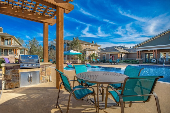 Relaxing Outdoor Grill and Eating Area at Riverside at Rockwater, North Little Rock, AR - Riverside at Rockwater Apartments
