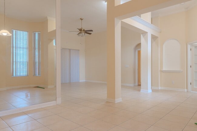 Photo - Spacious 5BR Home in Falcon Trace | 3-Car Garage | Screened Patio | Resort-Style Amenities Rent: ...