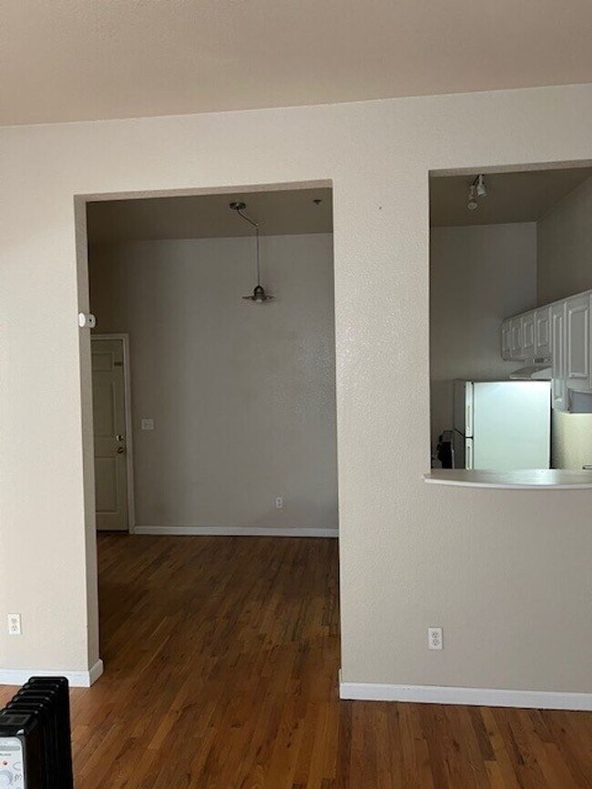 Photo - Large windows and exposed brick wall Unit 305