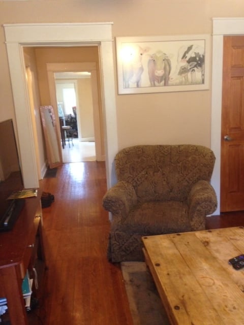 Living room looking down hall to kitchen. - 210 E Vermilya Ave