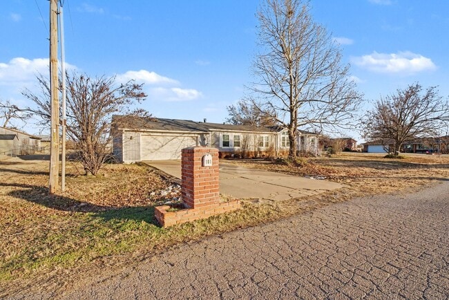 Photo - 3-Bed Home with Fireplace, Fenced Yard & Flexible Living Space