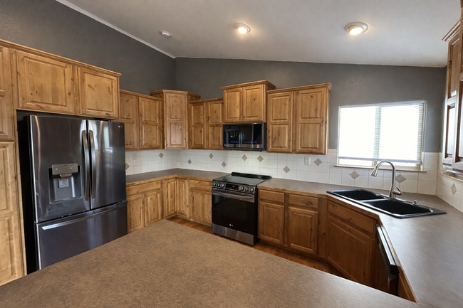 Photo - Spacious 5-Bedroom Home with Finished Basement and 3-Car Garage in Wellington