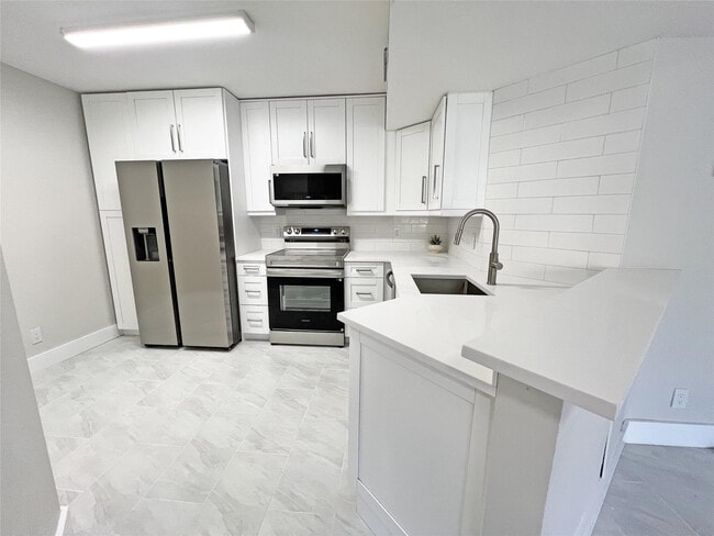 Photo - 9055 Wiles Rd Unit 208