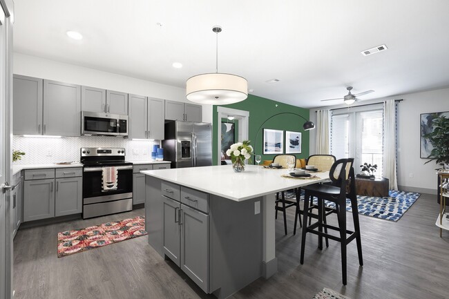 Our chef-inspired kitchens include designer finishes and stainless steel appliances. - Yaupon by Windsor Apartments