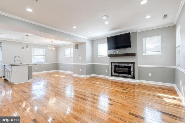 Photo - Welcome to this beautifully renovated 4bd 2bth end-of-group townhome in Baltimore!
