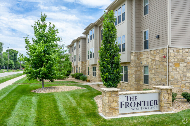 Beautifully Landscaped Grounds - The Frontier West Lawrence Apartments