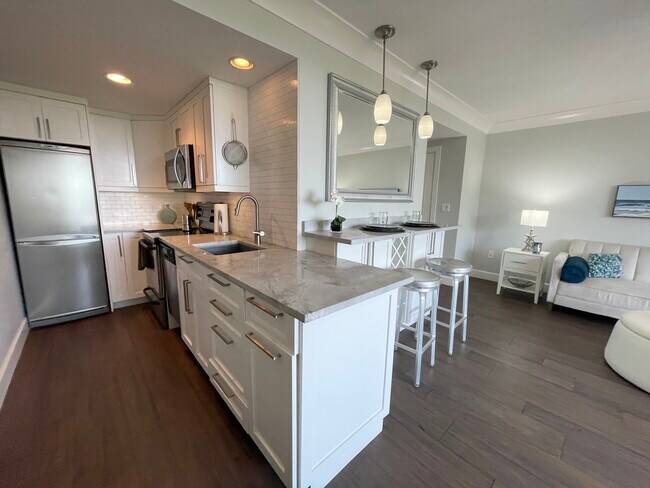 Marble counter with custom cabinets and storage
