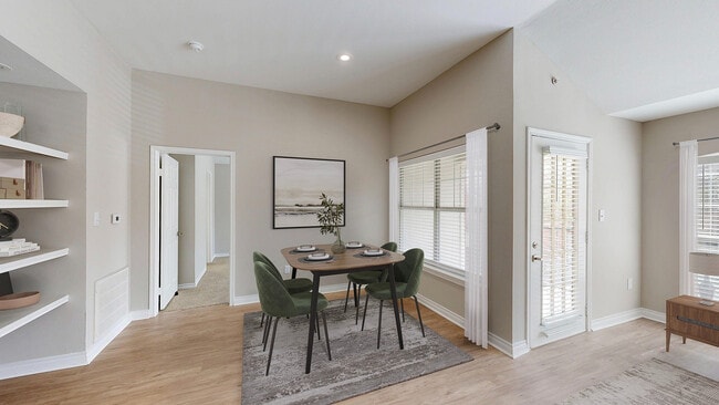 Newly Renovated Dining Area with Gorgeous Hardwood-Style Flooring - Lakeside at Coppell Apartments