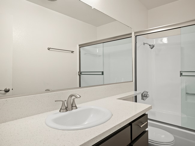 Modern styled bathroom with shower and tub.