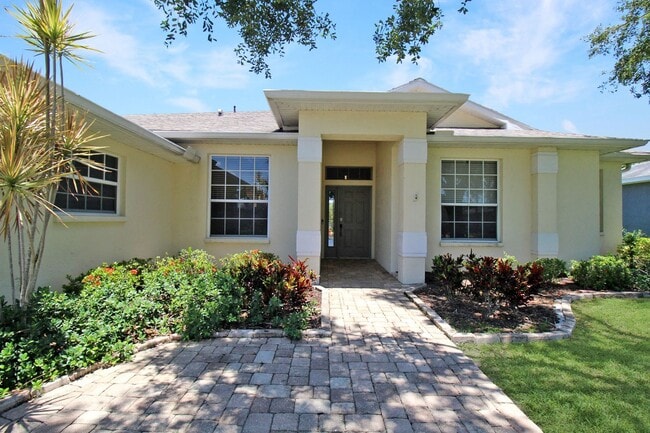 Photo - Annual rental: Spacious 3BR/2BA Creekwood Home with Office, Screened Lanai, EV Charger & Resort-S...
