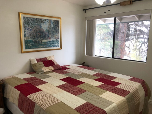 Bedroom 1 - Cal King size bed in picture. - 3200 S Litzler Dr Unit 1-201