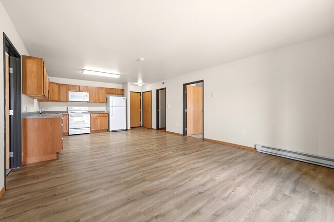Step into a world of comfort at Paramount at the Bluffs Apartments. This spacious living area features modern finishes, ample natural light, and easy access to essential amenities. Elevate your lifestyle today—schedule a tour now!
