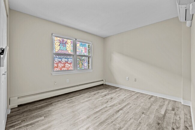 Spacious bedrooms with modern flooring and natural light at Mission Main.