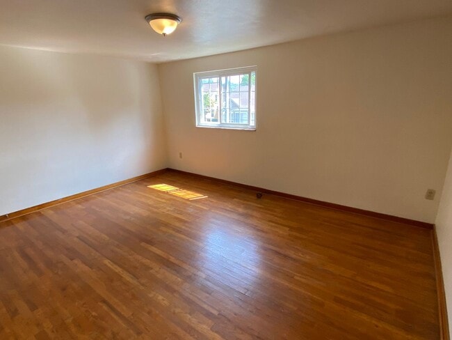 Photo - Charming Two Bedroom Townhome with a Private Basement & a Shared Backyard Space! Call Today!